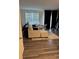 Comfortable living room featuring modern decor, light-colored furniture and wood-look floors at 536 Magnolia Cir # 116, Palmetto, GA 30268
