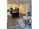 Well-lit and modern open living space with a sleek kitchen and a cozy living area with contemporary decor at 536 Magnolia Cir # 116, Palmetto, GA 30268