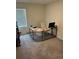 Bright office space with large window, modern desk, and neutral carpeting at 536 Magnolia Cir # 116, Palmetto, GA 30268