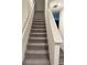 Carpeted stairs leading to the upper level of the home at 536 Magnolia Cir # 116, Palmetto, GA 30268