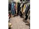 Spacious walk-in closet with clothing racks and shelving for ample storage, plus neutral carpeting at 536 Magnolia Cir # 116, Palmetto, GA 30268
