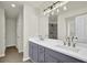 Modern bathroom featuring a double vanity with gray cabinets, white countertops and stylish lighting at 6341 Stewart Ridge Walk, Buford, GA 30518