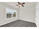 Inviting bedroom with carpet, ceiling fan, window, and neutral walls at 6341 Stewart Ridge Walk, Buford, GA 30518