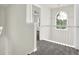 Hallway featuring neutral walls, plush carpet, a pendant light and a large window at 6341 Stewart Ridge Walk, Buford, GA 30518