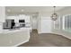 Bright kitchen with stainless steel appliances, white cabinets, and an island with counter seating at 6341 Stewart Ridge Walk, Buford, GA 30518