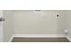A basic laundry room with hard surface floor, electrical outlets, and laundry hookups at 6341 Stewart Ridge Walk, Buford, GA 30518