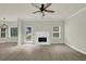Spacious living room features a fireplace, ceiling fan, and lots of natural light at 6341 Stewart Ridge Walk, Buford, GA 30518