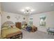 Shared bedroom with two twin beds, storage benches, and dinosaur themed decorations at 105 Paulowina Cir, Mcdonough, GA 30253