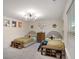 Shared bedroom with twin beds, storage benches, and a modern ceiling light at 105 Paulowina Cir, Mcdonough, GA 30253