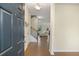Inviting entryway with hardwood floors, staircase, and a view into the spacious living area at 105 Paulowina Cir, Mcdonough, GA 30253