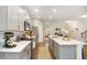Spacious kitchen featuring white countertops, modern appliances, and a view of the dining area at 105 Paulowina Cir, Mcdonough, GA 30253