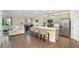 Modern kitchen with stainless steel appliances, island with seating, and an open concept design at 105 Paulowina Cir, Mcdonough, GA 30253