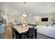 Open living and dining area, connecting a well-appointed kitchen and a large sofa at 105 Paulowina Cir, Mcdonough, GA 30253