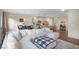 Open-concept floorplan with a living room, dining area, and a modern kitchen at 105 Paulowina Cir, Mcdonough, GA 30253