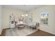 Bright office with natural light, desk, chair, shelving unit, and decorative rug at 105 Paulowina Cir, Mcdonough, GA 30253