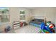 Bright ' room with a teepee, sofa, and lots of toys near the windows at 105 Paulowina Cir, Mcdonough, GA 30253