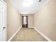 Bedroom featuring neutral colored walls, carpeted floors, and a small window at 130 Nicki Ct, Hampton, GA 30228