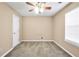 Bright bedroom with plush carpet, ceiling fan and ample natural light at 130 Nicki Ct, Hampton, GA 30228