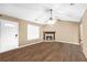 Cozy living room features a stone fireplace, providing a warm and inviting atmosphere at 130 Nicki Ct, Hampton, GA 30228