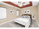 Bedroom featuring neutral colored walls, and a decorative ceiling at 130 Nicki Ct, Hampton, GA 30228