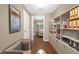 Well-organized office space featuring built-in shelving and hardwood floors at 130 Nicki Ct, Hampton, GA 30228