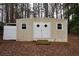Storage building featuring double doors and two windows at 130 Nicki Ct, Hampton, GA 30228