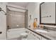 Cozy bathroom with granite counters, shower-tub combination and modern fixtures at 204 Starwood Ct, Acworth, GA 30102