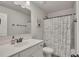 Bright bathroom with a vanity, mirror, toilet, and bathtub with a nautical-themed shower curtain at 204 Starwood Ct, Acworth, GA 30102