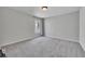 Spacious bedroom with soft carpet, neutral walls, and a window for natural light at 204 Starwood Ct, Acworth, GA 30102