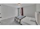 Comfortable bedroom with plush carpet, a window with curtains, and a neatly made bed at 204 Starwood Ct, Acworth, GA 30102