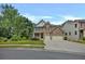A charming two-story home with a well-maintained lawn, mature trees, and a spacious driveway on a clear day at 204 Starwood Ct, Acworth, GA 30102