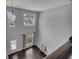 Two-story foyer with dark wood floors and large windows providing natural light at 204 Starwood Ct, Acworth, GA 30102