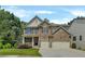 Traditional two-story home with a brick and stone facade and a well-manicured lawn with mature trees in the background at 204 Starwood Ct, Acworth, GA 30102