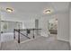 Upstairs hallway with carpet and wood banister leading to bedrooms at 204 Starwood Ct, Acworth, GA 30102