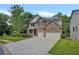 Beautiful two-story home with brick and stone accents, a lush lawn, and a wide driveway for easy parking at 204 Starwood Ct, Acworth, GA 30102
