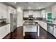 Bright kitchen featuring stainless appliances, white cabinets, and a granite island at 204 Starwood Ct, Acworth, GA 30102