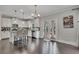 Well-lit kitchen with stainless steel appliances, white cabinets, and granite countertops at 204 Starwood Ct, Acworth, GA 30102