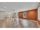 Bright living room with modern wood-look flooring, a projector, and recessed lighting at 204 Starwood Ct, Acworth, GA 30102
