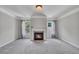 Comfortable living room with fireplace, neutral walls, and carpet floors at 204 Starwood Ct, Acworth, GA 30102