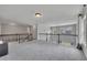 Spacious loft area with neutral carpeting, iron railing and natural light at 204 Starwood Ct, Acworth, GA 30102