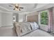 Large main bedroom with trey ceiling, decorative carpet, neutral paint, and many windows at 204 Starwood Ct, Acworth, GA 30102
