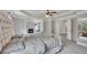 Large main bedroom with tufted headboard, fireplace, and tray ceiling at 204 Starwood Ct, Acworth, GA 30102