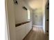 Bathroom featuring hardwood floors, modern vanities, and a tiled walk-in shower at 325 Garrison Se Dr, Marietta, GA 30060