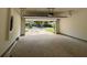 Spacious two-car garage featuring an automated door and a driveway leading to the backyard at 325 Garrison Se Dr, Marietta, GA 30060