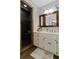 Bathroom with a vanity, framed mirror, walk-in shower, and tile flooring at 4381 Laurian Nw Dr, Kennesaw, GA 30144