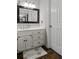 Bathroom with a vanity, framed mirror, tile flooring, and a white door at 4381 Laurian Nw Dr, Kennesaw, GA 30144