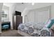 A bedroom features a sloped ceiling, ceiling fan, desk, and a flat screen television at 4381 Laurian Nw Dr, Kennesaw, GA 30144
