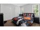 This bedroom features a basketball-themed bedding set and matching furniture, perfect for a sports enthusiast at 4381 Laurian Nw Dr, Kennesaw, GA 30144