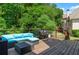 An outdoor deck featuring blue cushioned patio furniture and a grill, great for relaxing and entertaining at 4381 Laurian Nw Dr, Kennesaw, GA 30144