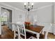Charming dining area with hardwood floors, a wooden table, and elegant decor at 4381 Laurian Nw Dr, Kennesaw, GA 30144